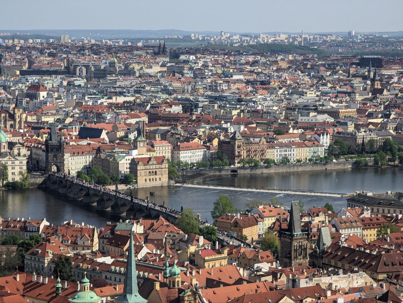 A city with a bridge over waterDescription automatically generated