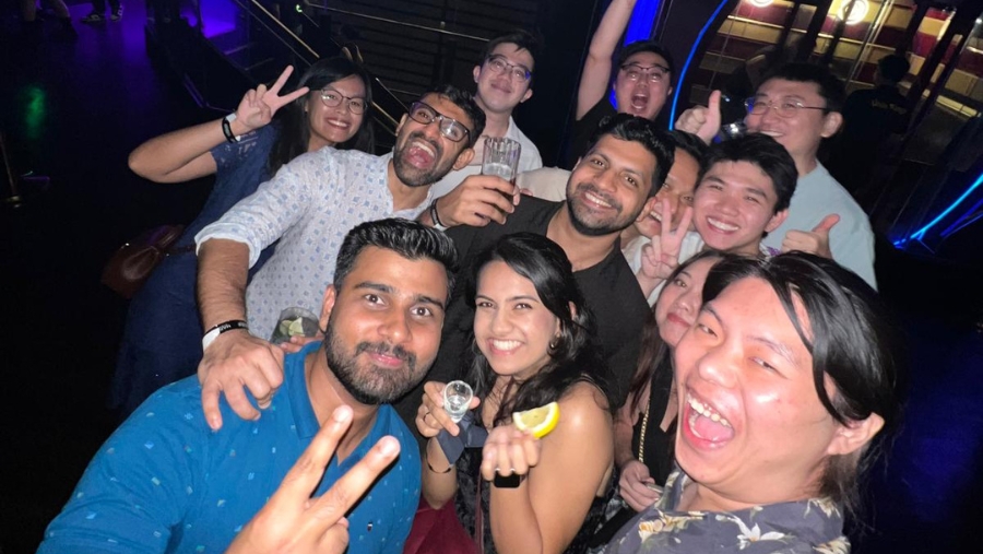 Beyond the classroom, Caleb (back row, 1st from left) bonded with fellow postgraduate students over drinks.
